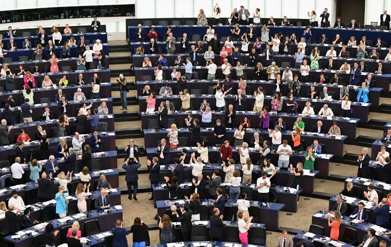 Members of the European Parliament react as they take part in a voting session on EU nature restoration law during a plenary session at the European Parliament in Strasbourg, eastern France, on July 12, 2023. The European Parliament on July 12, 2023 narrowly backed a key biodiversity bill aimed at rewilding EU land and water habitats, overcoming a backlash by conservative lawmakers who said it would hurt farmers. The text endorsing the Nature Restoration Law passed with 336 votes in favour, 300 against and 13 abstentions, setting the scene for the parliament to negotiate a final law on the issue with EU member state governments. (Photo by FREDERICK FLORIN / AFP)