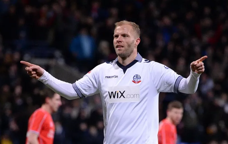 Bolton's Icelandic striker Eidur Gudjohnsen celebrates after scoring his team's first goal from a penalty during the FA Cup fourth round replay football match between Bolton and Liverpool at the Reebok Stadium in Bolton, on February 4, 2015. AFP PHOTO/OLI SCARFF

== RESTRICTED TO EDITORIAL USE. No use with unauthorized audio, video, data, fixture lists, club/league logos or live services. Online in-match use limited to 45 images, no video emulation. No use in betting, games or single club/league/player publications. / AFP / OLI SCARFF