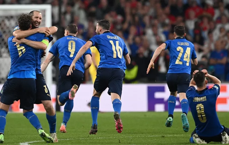Italy's players celebrate after winning the UEFA EURO 2020 final football match between Italy and England at the Wembley Stadium in London on July 11, 2021. (Photo by Andy Rain / POOL / AFP)