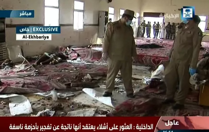 An image grab taken from Saudi Al-Ekhbaria TV on August 6, 2015 shows Saudi security forces inspecting the site of an explosion which was reported triggered by a suicide bomber at a mosque located inside a special forces headquarters in the city of Abha, in the southern province of Asir, near the border with Yemen. The bombing was the most serious in recent months against Saudi security forces, who have been targeted in attacks blamed on the Islamic State group. AFP PHOTO / HO / AL-EKHBARIA  
=== RESTRICTED TO EDITORIAL USE - MANDATORY CREDIT "AFP PHOTO / HO / AL-EKHBARIA" - NO MARKETING NO ADVERTISING CAMPAIGNS - DISTRIBUTED AS A SERVICE TO CLIENTS ===