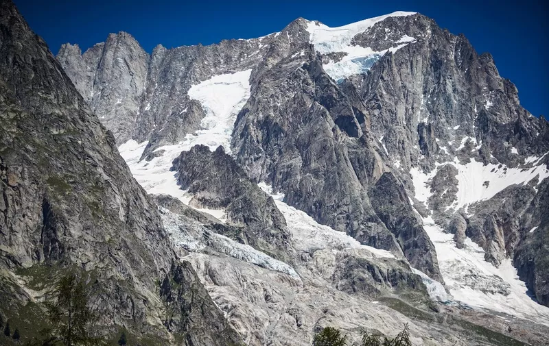 A picture taken on August 7, 2020 shows the Planpincieux glacier from the village of La Palud, in Courmayeur, Val Ferret, northwestern Italy. - Several dozen people have been evacuated in northwestern Italy as a huge chunk of a glacier in the Mont Blanc massif threatens to break off due to high temperatures. (Photo by Andrea BERNARDI / AFP)