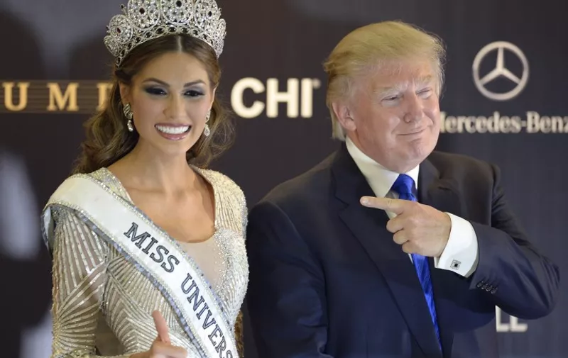 Co-owner if the Miss Unioverse Organization US billionaire Donald Trump (R) poses next to Miss Venezuela and Miss Universe 2013 Gabriela Isler after the 2013 Miss Universe competition in Moscow on November 9, 2013. Gabriela Isler, a 25-year-old Venezuelan television presenter, was crowned Miss Universe in Moscow in a glittering ceremony. Judges including rock star Steven Tyler from Aerosmith picked the winner from a total of 86 contestants at the show, watched by several billion viewers around the world.    AFP PHOTO / ALEXANDER NEMENOV / AFP PHOTO / ALEXANDER NEMENOV