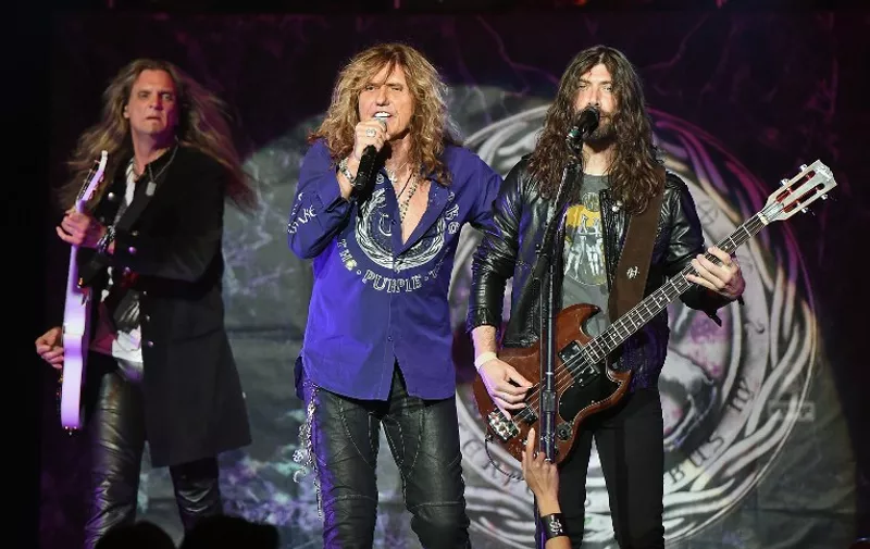 LAS VEGAS, NV - JUNE 04: (L-R) Guitarist Joel Hoekstra, singer David Coverdale and bassist Michael Devin of Whitesnake perform at The Joint inside the Hard Rock Hotel &amp; Casino as the band tours in support of "The Purple Album" on June 4, 2015 in Las Vegas, Nevada.   Ethan Miller/Getty Images/AFP