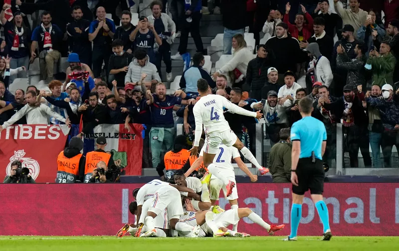 Players celebrate after France's Theo Hernandez scored his side's third goal during the UEFA Nations League semifinal soccer match between Belgium and France at the Juventus stadium, in Turin, Italy, Thursday, Oct. 7, 2021. (AP Photo/Luca Bruno)