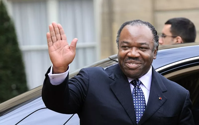 (FILES) Gabonese President Ali Bongo Ondimba waves as he leaves the Elysee Palace after a meeting with French President Nicolas Sarkozy at the Elysee Palace in Paris, on February 21, 2011. A group of Gabonese military officers appeared on television on August 30, 2023 announcing they were "putting an end to the current regime" and scrapping official election results that had handed another term to veteran President Ali Bongo Ondimba.
During the announcement, AFP journalists heard gunfire ring out in the Gabonese capital, Libreville. (Photo by Eric Feferberg / AFP)