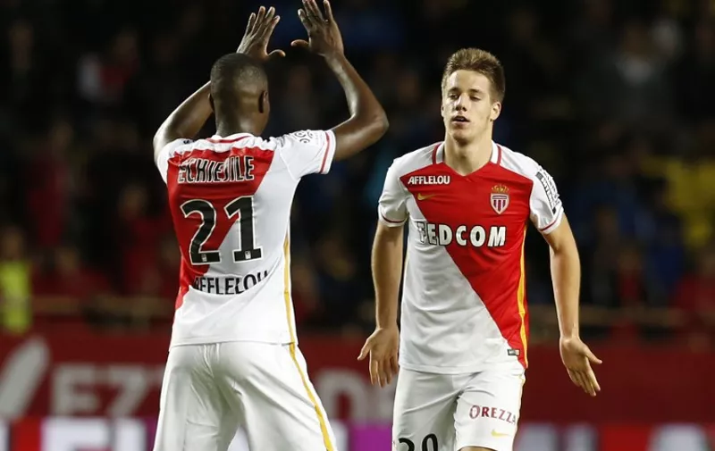 Monaco's Croatian midfielder Mario Pasalic (R) celebrates with Monaco's defender Nigerian Elderson Uwa Echiejile (L) after scoring a goal during the French L1 football match between Monaco (ASM) and Lyon (OL) on October 16, 2015 at the Louis II Stadium in Monaco.  AFP PHOTO / VALERY HACHE
