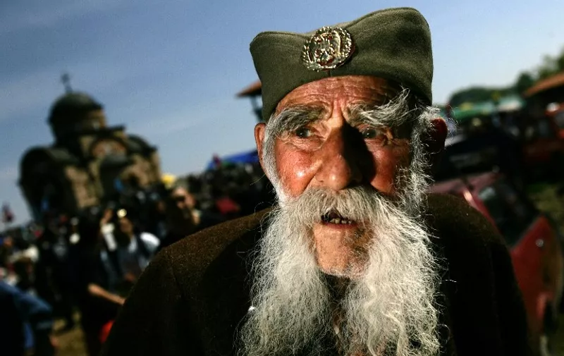 Milija Savic, 97, the oldest member of the Chetniks, World War II royalist militaries fighting against Nazis, but also communist partisans, at Mt. Ravna Gora, 13 May 2006. Thousands of people every year attend the rally marking the  anniversary of the execution of  chetnik leader Draza Mihajlovic.        AFP PHOTO / DIMITAR DILKOFF