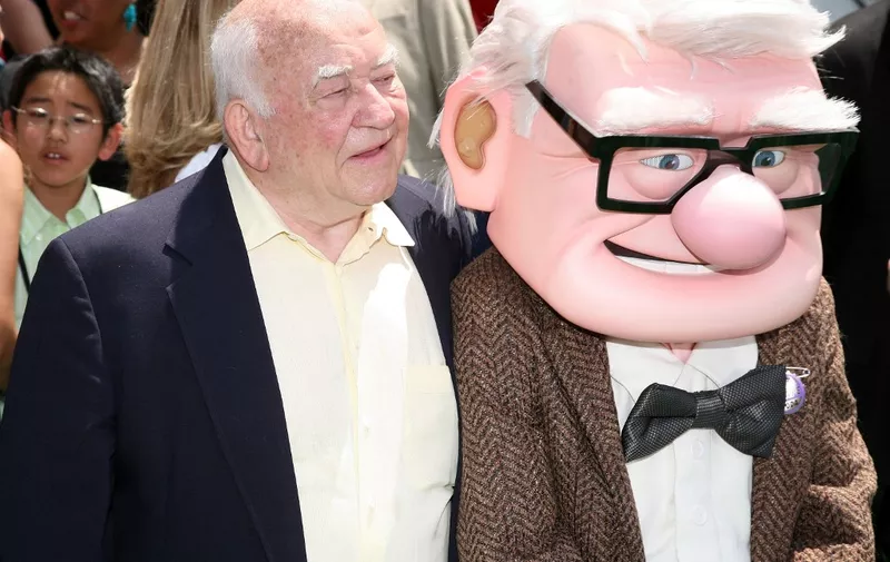 (FILES) In this file photo actor Ed Asner and character Carl Fredricksen arrive for the premiere of Disney Pixar's "Up" at the El Capitan Theatre in Hollywood on May 16, 2009. - Ed Asner, the prolific US character actor who became a star in middle age as the gruff but lovable newsman Lou Grant, first in the hit TV comedy The Mary Tyler Moore Show and later in the drama Lou Grant, died on August 29, 2021. He was 91. (Photo by Valerie MACON / AFP)