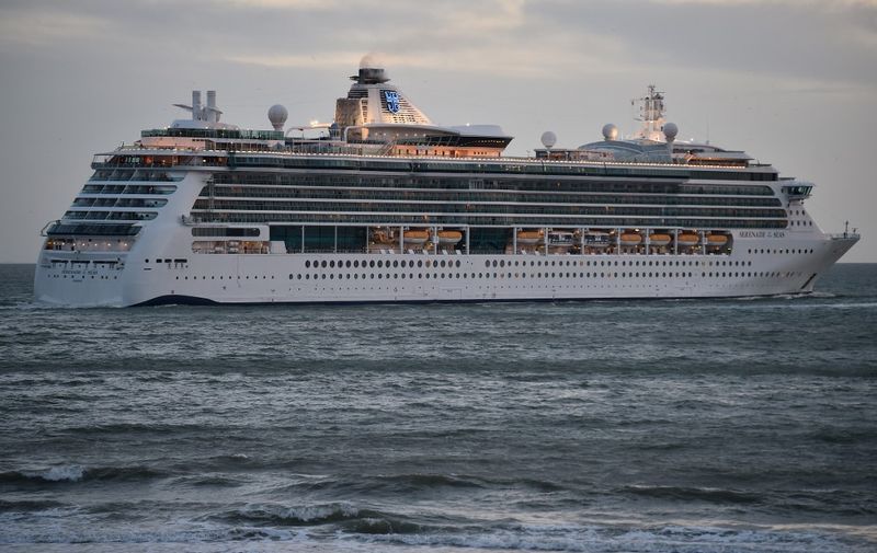 Royal Caribbean Cruises liner Serenade of the Sea leaves the access channel from Le Havre harbour, northern France, on May 8, 2019. (Photo by JEAN-FRANCOIS MONIER / AFP)