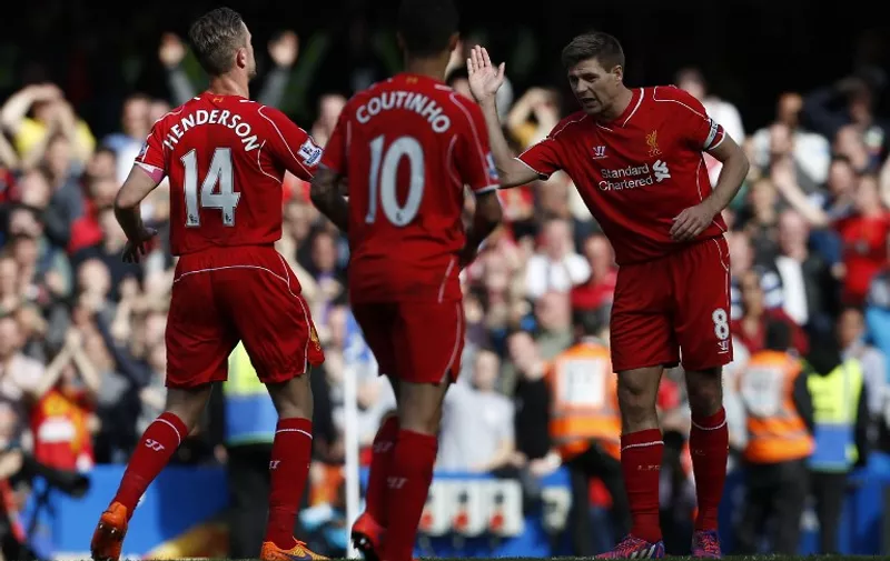 Liverpool's English midfielder Steven Gerrard (R) celebrates scoring the equalising 1-1 goal during the English Premier League football match between Chelsea and Liverpool at Stamford Bridge in London on May 10, 2015. AFP PHOTO / IAN KINGTON

RESTRICTED TO EDITORIAL USE. No use with unauthorized audio, video, data, fixture lists, club/league logos or live services. Online in-match use limited to 45 images, no video emulation. No use in betting, games or single club/league/player publications.