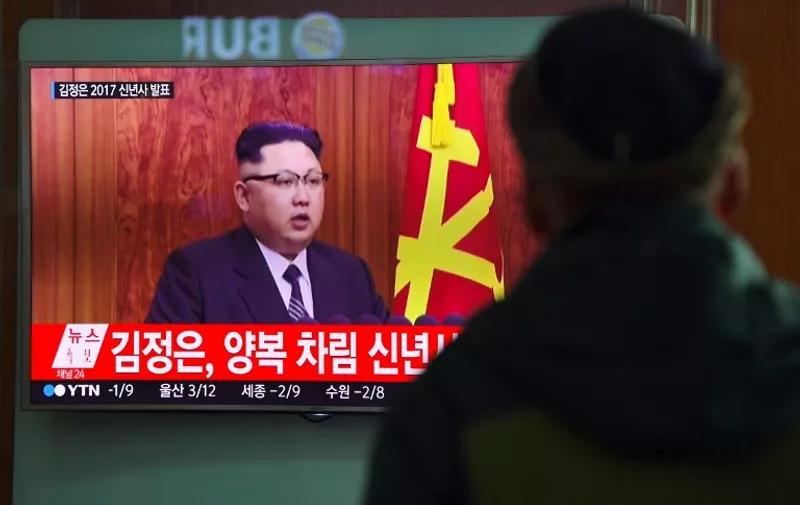 A man watches a television news broadcast at a railway station in Seoul on January 1, 2017 showing North Korean leader Kim Jong-Un's New Year's speech.
North Korea is in the "final stages" of developing an intercontinental ballistic missile, leader Kim Jong-Un said on January 1, claiming the country had significantly bolstered its nuclear deterrent. / AFP PHOTO / JUNG Yeon-Je