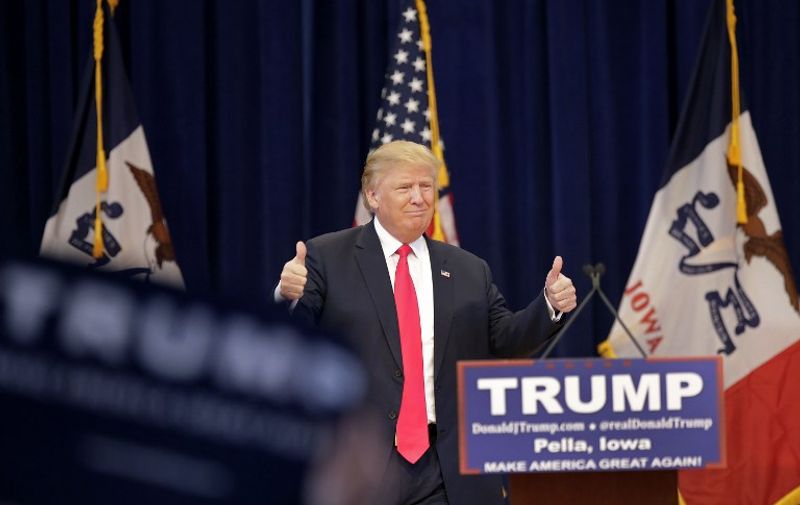 PELLA, IA - JANUARY 23: Republican presidential candidate Donald Trump gives a thumbs-up as he is introduced during a campaign event January 23, 2016 in Pella, Iowa. Trump, who is seeking the nomination from the Republican Party is on the presidential campaign trail across Iowa ahead of the Iowa Caucus taking place February 1.   Joshua Lott/Getty Images/AFP