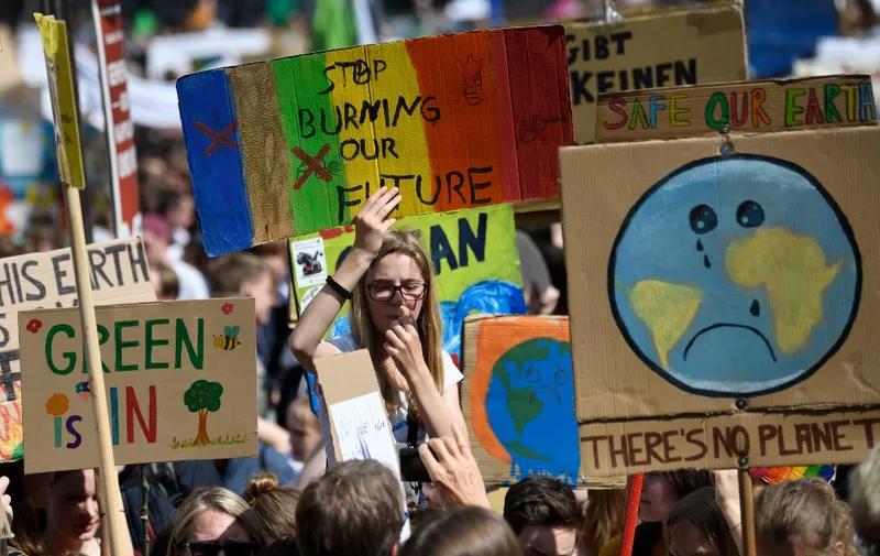 Youth climate activists protest at a weekly Fridays for Future demonstration ahead the Europe elections on May 24, 2019 in Cologne, western Germany. (Photo by INA FASSBENDER / AFP)