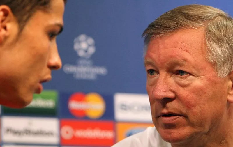 Manchester United's manager Sir Alex ferguson (R) chats with Portuguese Cristiano Ronaldo (L) as they attend a press conference at Alvalade XXI Stadium in Lisbon, 18 September 2007. Machester United faces Sporting of Lisbon 19 September in a Champions League group F football match. AFP PHOTO/FRANCISCO LEONG / AFP / FRANCISCO LEONG