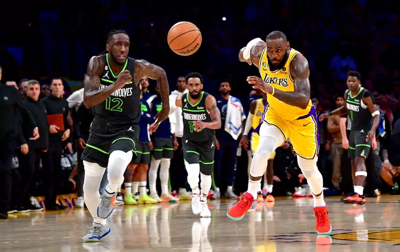 Apr 11, 2023; Los Angeles, California, USA; Los Angeles Lakers forward LeBron James (6) chases for the ball against Minnesota Timberwolves forward Taurean Prince (12) during the second half at Crypto.com Arena. Mandatory Credit: Gary A. Vasquez-USA TODAY Sports