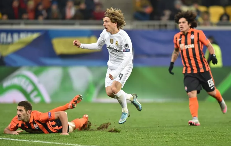 Real Madrid's Croatian midfielder Luka Modric (C) reacts after scoring during the UEFA Champions League group A football match between Shakhtar Donetsk and Real Madrid in Lviv on November 25, 2015. AFP PHOTO / SERGEI SUPINSKY /