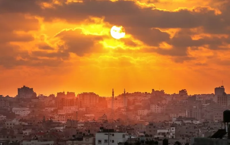 The sun prepares to set over Gaza City on May 15, 2018.
Israel was under mounting international pressure amid calls for an independent probe after its forces killed 60 Palestinians during violence along the Gaza border as the United States opened an embassy in Jerusalem. / AFP PHOTO / MAHMUD HAMS