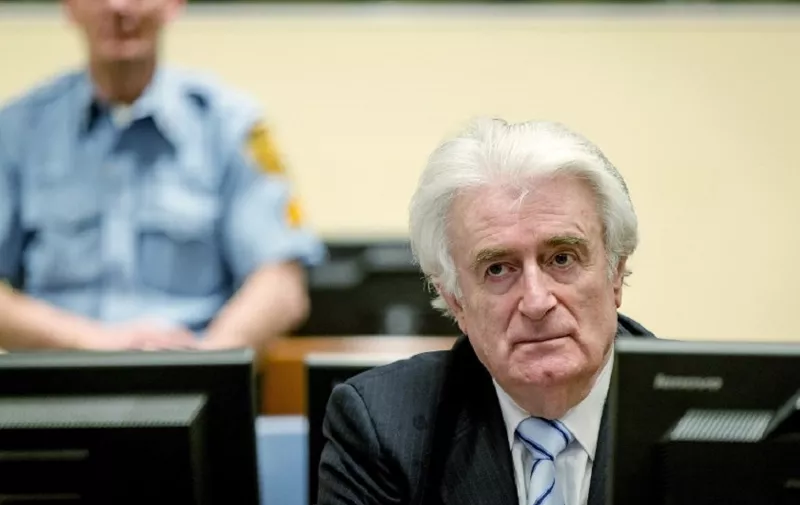 (FILES) In this file photo taken on March 24, 2016 Bosnian Serb wartime leader Radovan Karadzic sits in the courtroom for the reading of his verdict at the International Criminal Tribunal for Former Yugoslavia (ICTY) in The Hague.
UN judges on April 23, 2018 begin hearing the two-day appeal of once-feared Bosnian Serb leader Radovan Karadzic, fighting his conviction and 40-year jail term for war crimes and genocide in Bosnia's bloody 1990s conflict.  / AFP PHOTO / POOL / Robin van Lonkhuijsen / Netherlands OUT
