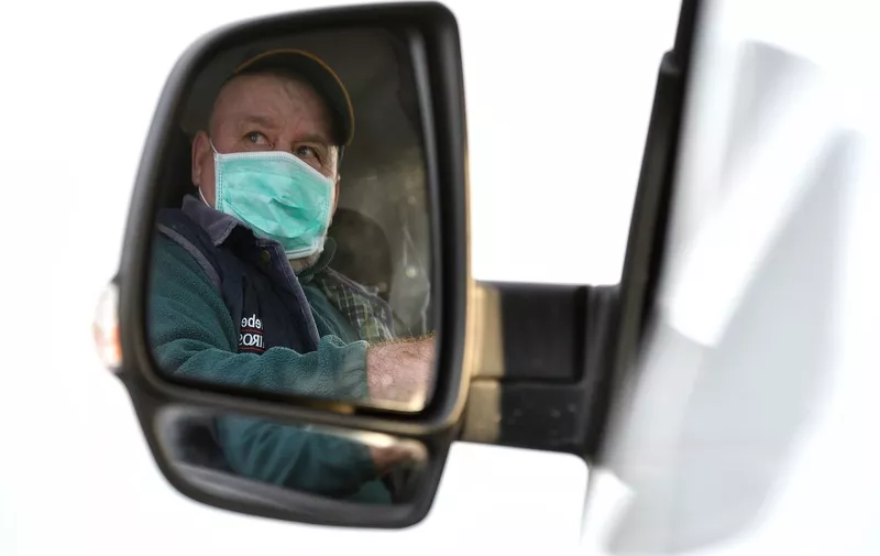 Man with protective mask is reflected on the rear view mirror of her car in the army checkpoint on the border of the red zone for the containment of the coronavirus epidemic in Turano Lodigiano
Coronavirus outbreak, Lombardy, Italy - 27 Feb 2020,Image: 501704963, License: Rights-managed, Restrictions: , Model Release: no