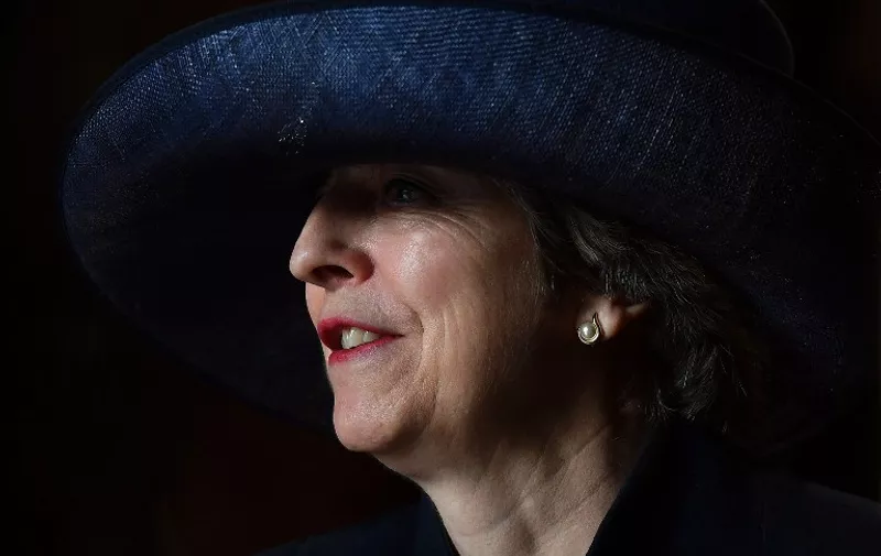 British Prime Minister Theresa May leaves after attending a Commonwealth Day Service at Westminster Abbey in central London, on March 13, 2017.
Queen Elizabeth II has been Head of the Commonwealth throughout her reign. Organised by the Royal Commonwealth Society, the Service is the largest annual inter-faith gathering in the United Kingdom. / AFP PHOTO / POOL / Ben STANSALL