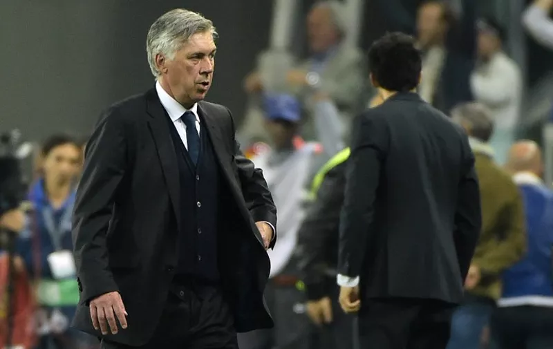 Real Madrid's Italian coach Carlo Ancelotti leaves at the end of the UEFA Champions League semi-final first leg football match Juventus vs Real Madrid on May 5, 2015 at the Juventus stadium in Turin. Juventus won 2-1.        AFP PHOTO / OLIVIER MORIN