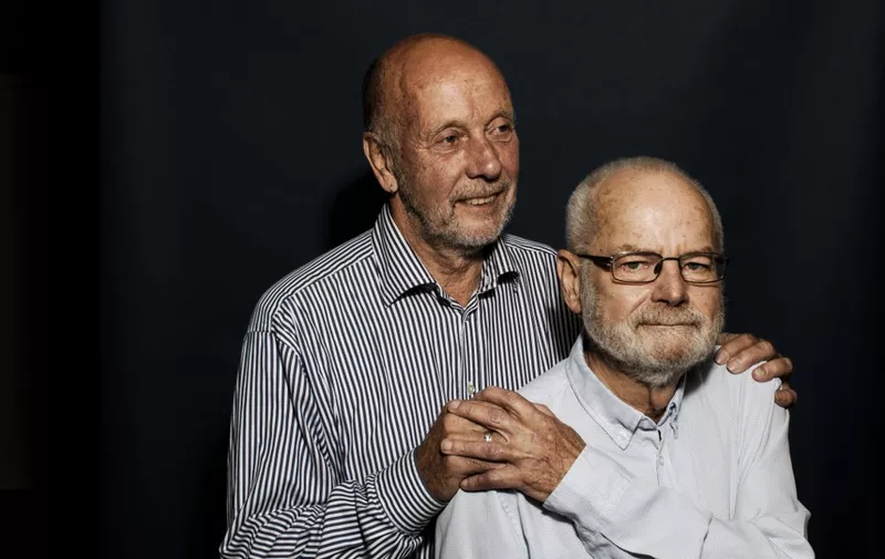 Ove Carlsen (L) and Ivan Larsen pose for a photo on September 23, 2019 in Frederiksberg, Denmark. - Thirty years after Denmark became the first country to allow same-sex couples to register in legal unions, the world has become more accepting, but in 1989 it was a trailblazing move. (Photo by Thibault SAVARY / AFP)