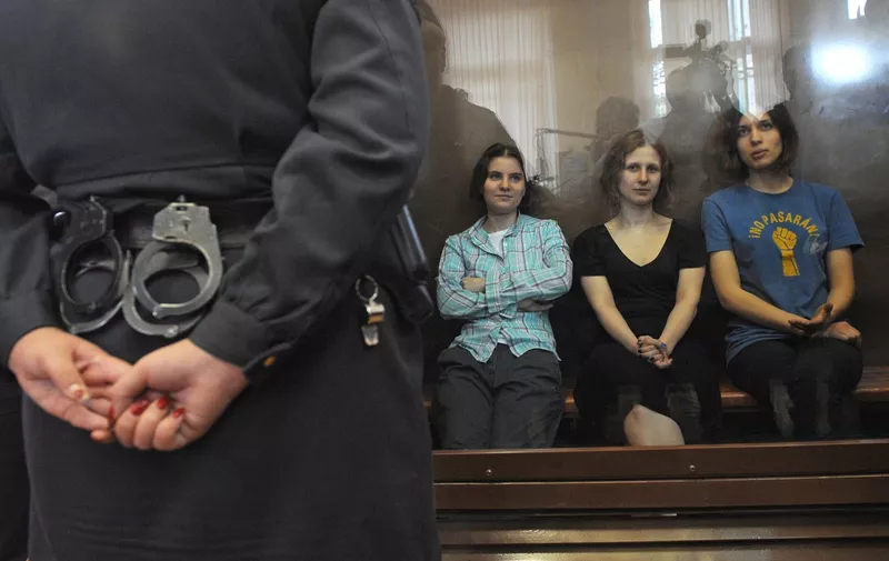 MOSCOW, RUSSIA. AUGUST 17, 2012. Nadezhda Tolokonnikova, Maria Alyokhina, Yekaterina Samutsevich (R-L), members of the punk trio 'Pussy Riot', in the courtroom 'aquarium' at a court hearing in Khamovniki district court (Khamovnichesky court). The Pussy girls are accused of hooliganism for performing an anti-Putin song at Moscow's Christ the Savior Cathedral on February 21, 2012.,Image: 139901744, License: Rights-managed, Restrictions: , Model Release: no, Credit line: Profimedia