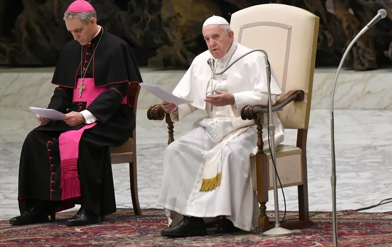 Pope Francis (R) assisted by Prefect of the Papal Household, German Archbishop Georg Gaenswein, speaks during the weekly general audience on January 15, 2020 at Paul-VI hall in the Vatican. (Photo by ALBERTO PIZZOLI / AFP)