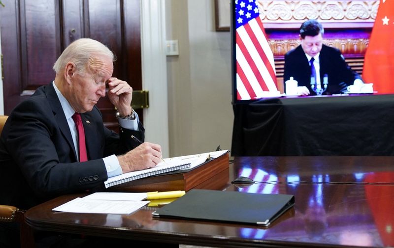 US President Joe Biden gestures as he meets with China's President Xi Jinping during a virtual summit from the Roosevelt Room of the White House in Washington, DC, November 15, 2021. (Photo by MANDEL NGAN / AFP)