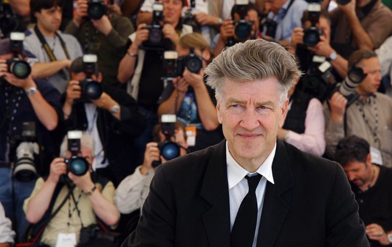 The jury's president of the 55th Cannes Film Festival, US director David Lynch poses for photographers during a photocall on a terrace of the Palais des festivals 15 May 2002 before the opening ceremony. Twenty-two films are in competition for the Golden Palm. US director Woody Allen's latest movie "Hollywood Ending" will open the festival today out of competition.  AFP PHOTO OLIVIER LABAN-MATTEI