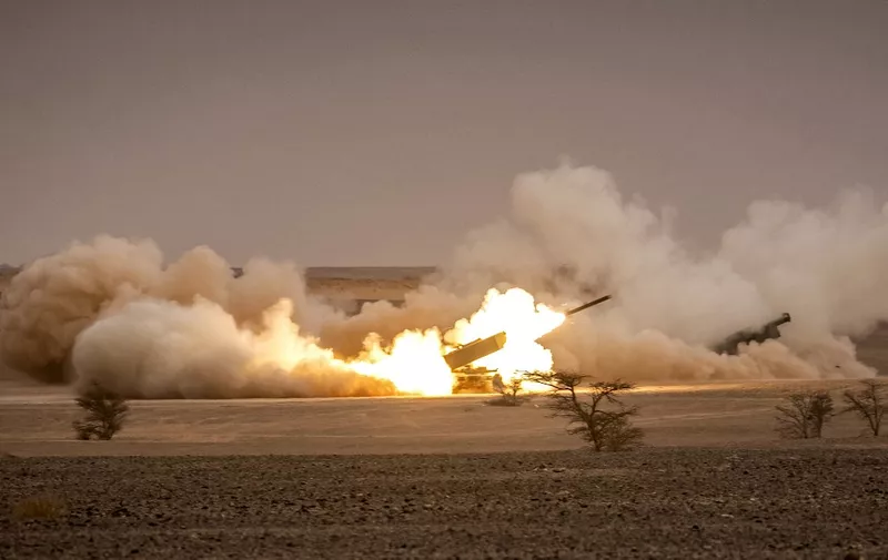 US M142 High Mobility Artillery Rocket System (HIMARS) launchers fire salvoes during the "African Lion" military exercise in the Grier Labouihi region in southeastern Morocco on June 9, 2021. (Photo by FADEL SENNA / AFP)
