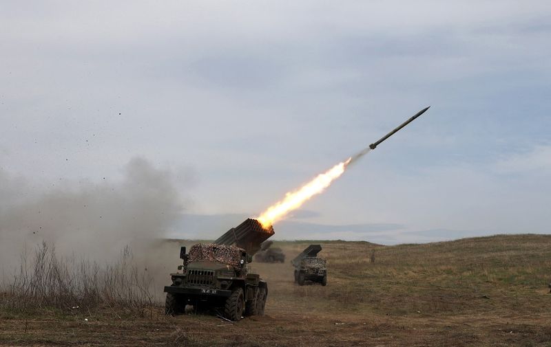 A Ukrainian multiple rocket launcher BM-21 "Grad" shells Russian troops' position, near Lugansk, in the Donbas region, on April 10, 2022. (Photo by Anatolii STEPANOV / AFP)