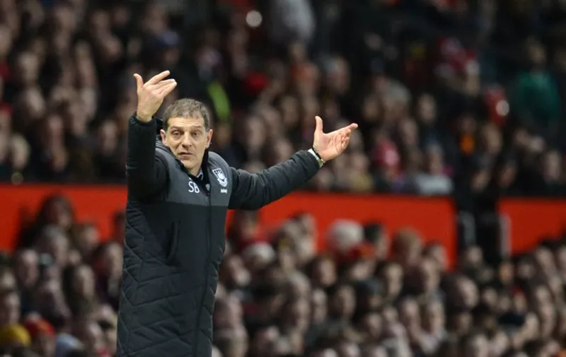 West Ham United's Croatian manager Slaven Bilic gestures during the English Premier League football match between Manchester United and West Ham United at Old Trafford in Manchester, north west England, on December 5, 2015.  AFP PHOTO / OLI SCARFF

RESTRICTED TO EDITORIAL USE. No use with unauthorized audio, video, data, fixture lists, club/league logos or 'live' services. Online in-match use limited to 75 images, no video emulation. No use in betting, games or single club/league/player publications. / AFP / OLI SCARFF