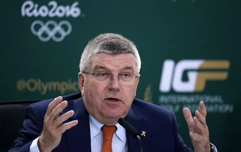 Thomas Bach, president of the International Olympic Committee, addresses a press conference on golf in the Olympics, at St Andrews in Scotland, on July 18, 2015, during the 2015 Open Golf Championship. AFP PHOTO / ADRIAN DENNIS