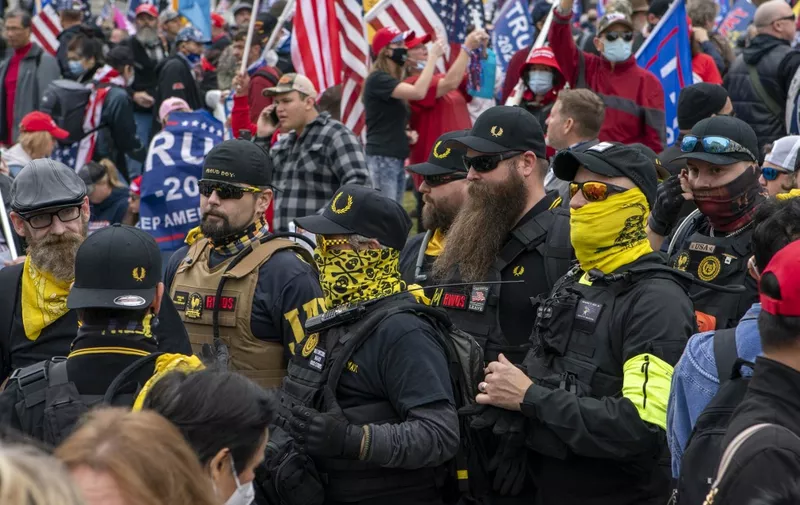 (FILES) In this file photo taken on December 12, 2020 members of the Proud Boys join supporters of US President Donald Trump as they demonstrate in Washington, DC. - Four members of the far-right Proud Boys were convicted of seditious conspiracy on May 4, 2023for their roles in the January 6, 2021 attack on the US Capitol, US media reported. (Photo by Jose Luis Magana / AFP)