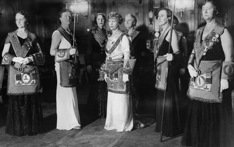 Seton Challen (C), Grand Master of the Honourable Fraternity of Ancient Freemasons, then the only masonic fraternity organised entirely by women, is seen after her ceremony of masonic ritual on December 14, 1934 on St Ermin's Hotel in London. (Photo by PLANET NEWS / AFP)