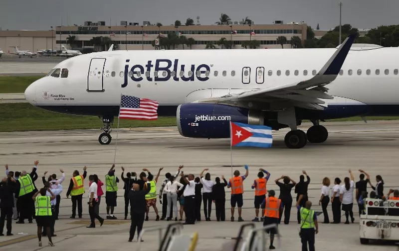 FORT LAUDERDALE, FL - AUGUST 31: Workers and officials watch as JetBlue Flight 387 prepares for take off as it becomes the first scheduled commercial flight to Cuba since 1961 on August 31, 2016 in Fort Lauderdale, Florida. JetBlue which hopes to have as many as 110 daily flights is the first U.S. airline to resume regularly scheduled airline service under new rules allowing Americans greater access to Cuba.   Joe Raedle/Getty Images/AFP