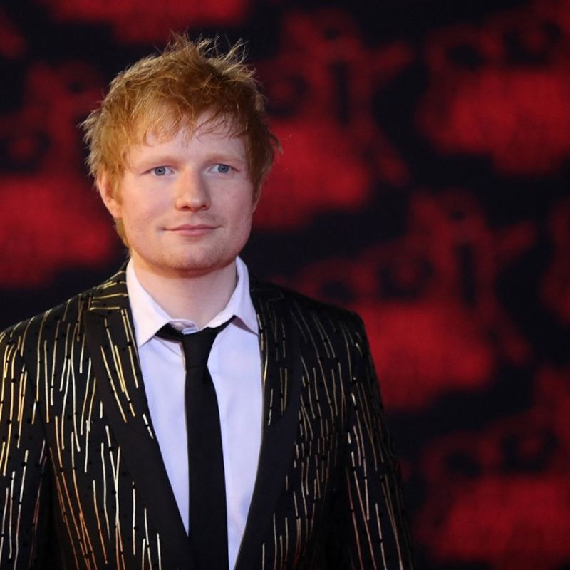 British singer Edward Christopher Sheeran aka 'Ed Sheeran' poses on the red carpet prior the 23st NRJ Music Awards ceremony at the Palais des Festivals in Cannes, south-eastern France, on November 20, 2021. (Photo by Valery HACHE / AFP)