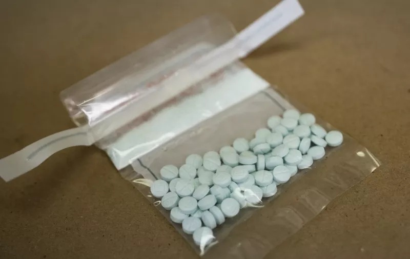 Tablets believed to be laced with fentanyl are displayed at the Drug Enforcement Administration Northeast Regional Laboratory on October 8, 2019 in New York. According to US government data, about 32,000 Americans died from opioid overdoses in 2018. That accounts for 46 percent of all fatal overdoses. Fentanyl, a powerful painkiller approved by the US Food and Drug Administration for a range of conditions, has been central to the American opioid crisis which began in the late 1990s. (Photo by Don EMMERT / AFP)