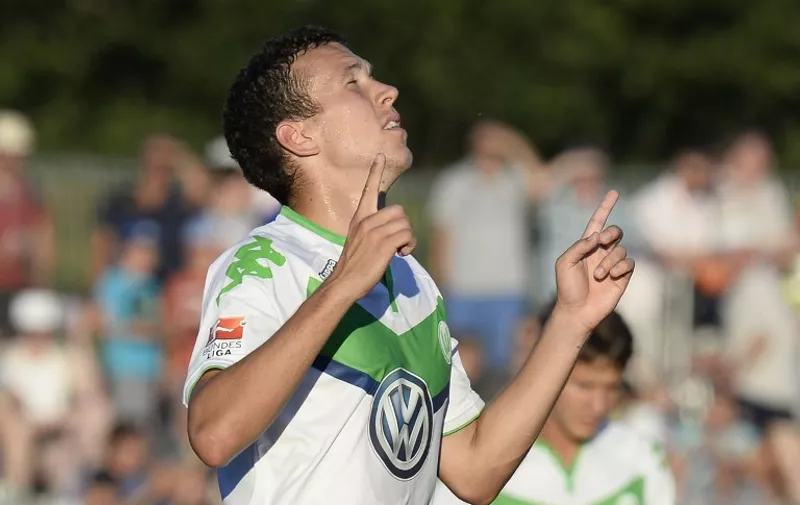 Wolfsburg's Croatian midfielder Ivan Perisic reacts after he scored in a friendly football match between German first division Bundesliga  team VfL Wolfsburg and Swiss first division team FC Zurich in Singen, southern Germany, on July 21, 2015. 