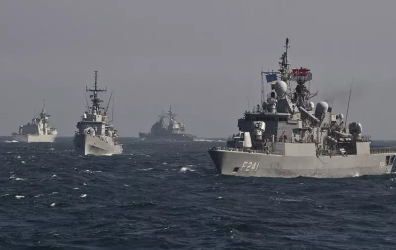 War ships of the NATO Standing Maritime Group-2 take part in a military drill on the Black Sea, 60km from Constanta city March 16, 2015. NATO Standing Maritime Group-2 (SNMG-2) is one of four groups multinational naval NATO forces and is headed by US Admiral Brad Williamson. The group consists of four frigates from Canada, Turkey, Italy and Romania, a cruiser (US ship commander) and an auxiliary vessel from Germany. AFP PHOTO DANIEL MIHAILESCU / AFP / DANIEL MIHAILESCU