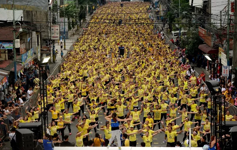 TOPSHOTS
Filipino residents participate in a Zumba class in an attempt to break the Guinness World Record in Mandaluyong on July 19, 2015. Residents broke the record for the largest Zumba class with 12,975 participants in a single venue.    AFP PHOTO / NOEL CELIS