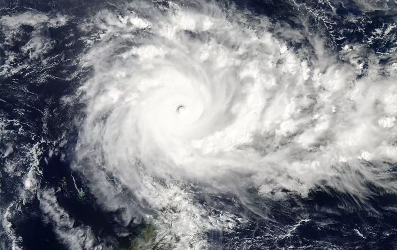 This April 18, 2016 NASA Aqua satellite image shows Tropical Cyclone Fantala off Madagascar. - Powerful Tropical Cyclone Fantala was churning in the western Indian Ocean Monday morning (U.S. time) with maximum sustained winds of 175 mph, according to the US military's Joint Typhoon Warning Center. This makes Fantala equivalent in strength to a Category 5 hurricane on the Saffir-Simpson Hurricane Wind Scale. (Photo by Handout / NASA / AFP)