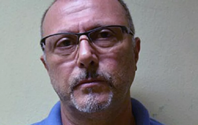 Handout picture released by Brazil's Federal Police of Italian national Pasquale Scotti, 56, sentenced to life imprisonment in Italy for his bonds with the maffia and arrested on May 26, 2015 in Recife, northeastern Brazil in a joint operation with Interpol. The Italian authorities have already began the process to extradite Scotti.  AFP PHOTO/POLICIA FEDERAL/HO  MAXIMUM QUALITY AVAILABLE  RESTRICTED TO EDITORIAL USE - MANDATORY CREDIT "AFP PHOTO/POLICIA FEDERAL/HO" - NO MARKETING NO ADVERTISING CAMPAIGNS - DISTRIBUTED AS A SERVICE TO CLIENTS
