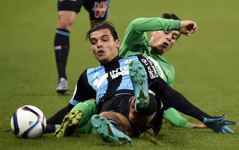Saint-Etienne's French forward Romain Hamouma (behind) vies with Marseille's Dutch defender Karim Rekik (front) during the French Ligue 1 football match between AS Saint-Etienne and Olympique de Marseille, on November 22, 2015 at the Geoffroy Guichard stadium in Saint-Etienne, central France. AFP PHOTO/PHILIPPE DESMAZES / AFP / PHILIPPE DESMAZES