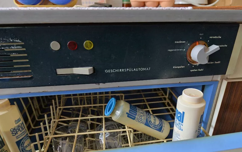 An AKA-Electric dishwasher is on display at the "Honniland" GDR museum in Chemnitz, eastern Germany on August 26, 2014. The museum consisting of two apartments shows objects dating from the time and life in the German Democratic Republic. The name of the museum refers to the former General Secretary of the GDR's Socialist Unity Party, Erich Honecker. AFP PHOTO / DPA / HENDRIK SCHMIDT +++ GERMANY OUT (Photo by HENDRIK SCHMIDT / DPA / AFP)