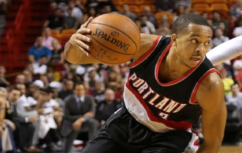 MIAMI, FL - DECEMBER 20: C.J. McCollum #3 of the Portland Trail Blazers drives to the basket during a game against the Miami Heat at American Airlines Arena on December 20, 2015 in Miami, Florida. NOTE TO USER: User expressly acknowledges and agrees that, by downloading and/or using this photograph, user is consenting to the terms and conditions of the Getty Images License Agreement. Mandatory copyright notice:   Mike Ehrmann/Getty Images/AFP