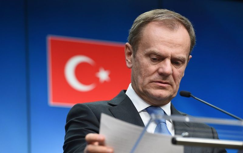 European Council President Donald Tusk addresses a press conference at the end of an EU leaders summit with Turkey centered on the the migrants crisis, at the European Council, in Brussels on March 8, 2016. 
European Union leaders will on March 7 back closing down the Balkans route used by most migrants to reach Europe, diplomats said, after at least 25 more people drowned trying to cross the Aegean Sea en route to Greece. The declaration drafted by EU ambassadors on March 6 will be announced at a summit in Brussels on March 7, set to also be attended by Turkish Prime Minister Ahmet Davutoglu. / AFP / EMMANUEL DUNAND
