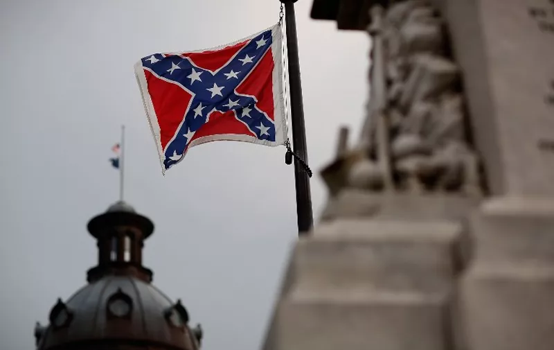 COLUMBIA, SC - JUNE 23: The Confederate flag flies on the Capitol grounds one day after South Carolina Gov. Nikki Haley announced that she will call for the Confederate flag to be removed on June 23, 2015 in Columbia, South Carolina. Debate over the flag flying at the Capitol was again ignited off after nine people were shot and killed during a prayer meeting at the Emanuel African Methodist Episcopal Church in Charleston, South Carolina.   Win McNamee/Getty Images/AFP