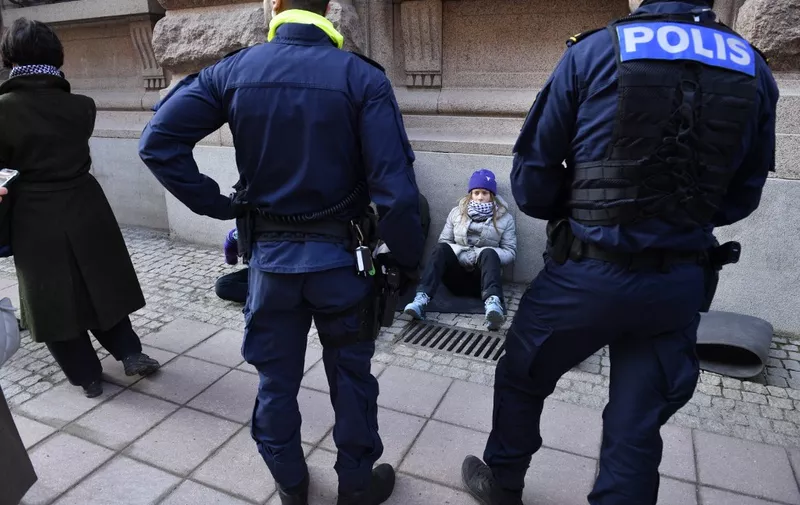 The climate activist Greta Thunberg was dragged away by police during a climate action outside the Swedisg parliament Riksdagen Tuesday morning.
Photo Samuel Steén / TT code 12170 (Photo by Samuel Steén / TT NEWS AGENCY / TT News Agency via AFP)